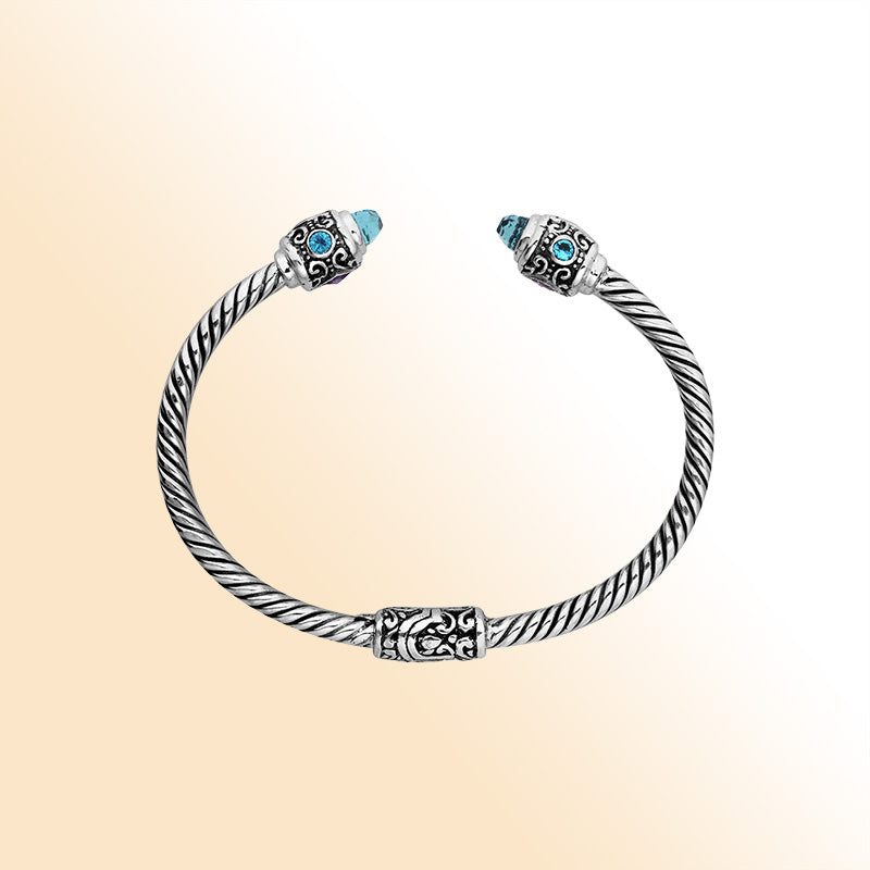 Handcrafted sterling silver bangle with Blue Topaz Quartz and Amethyst Quartz stones made in Bali.