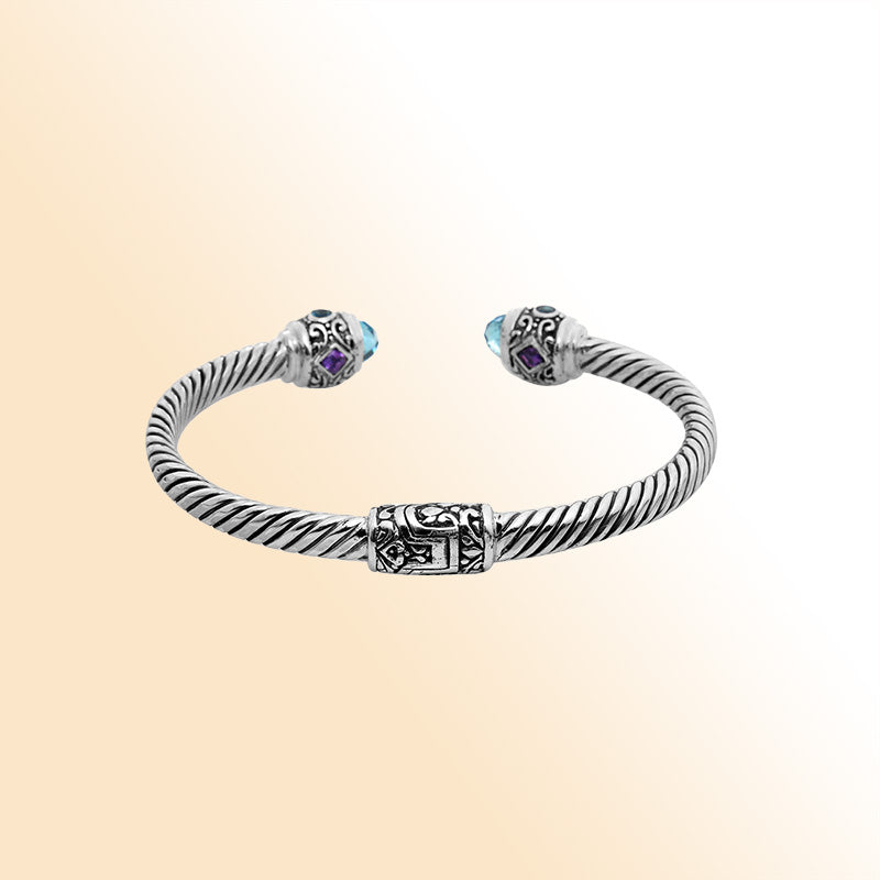 Handcrafted sterling silver bangle with Blue Topaz Quartz and Amethyst Quartz stones made in Bali.