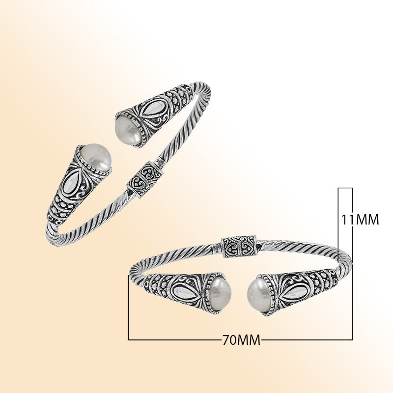 Elegant sterling silver open bangle with pearl accents and detailed Balinese pattern