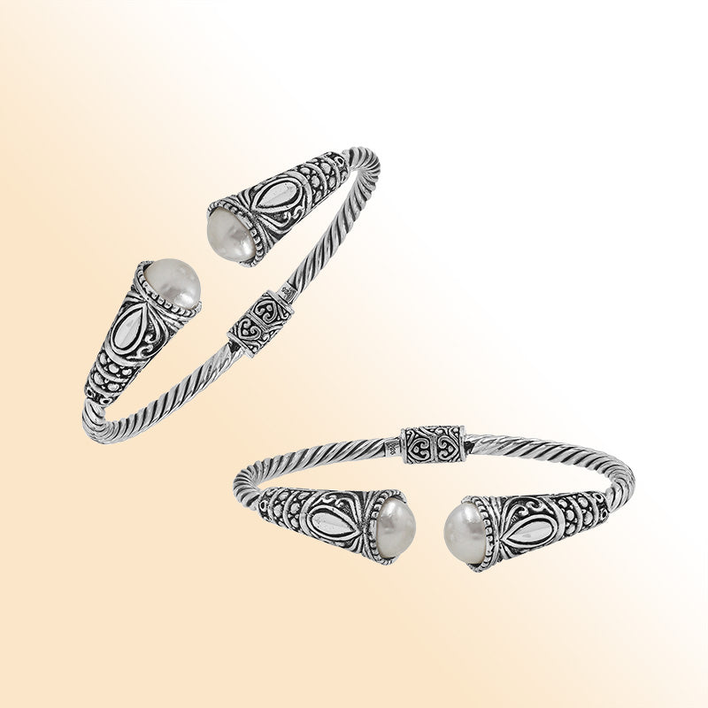 Elegant sterling silver open bangle with pearl accents and detailed Balinese pattern