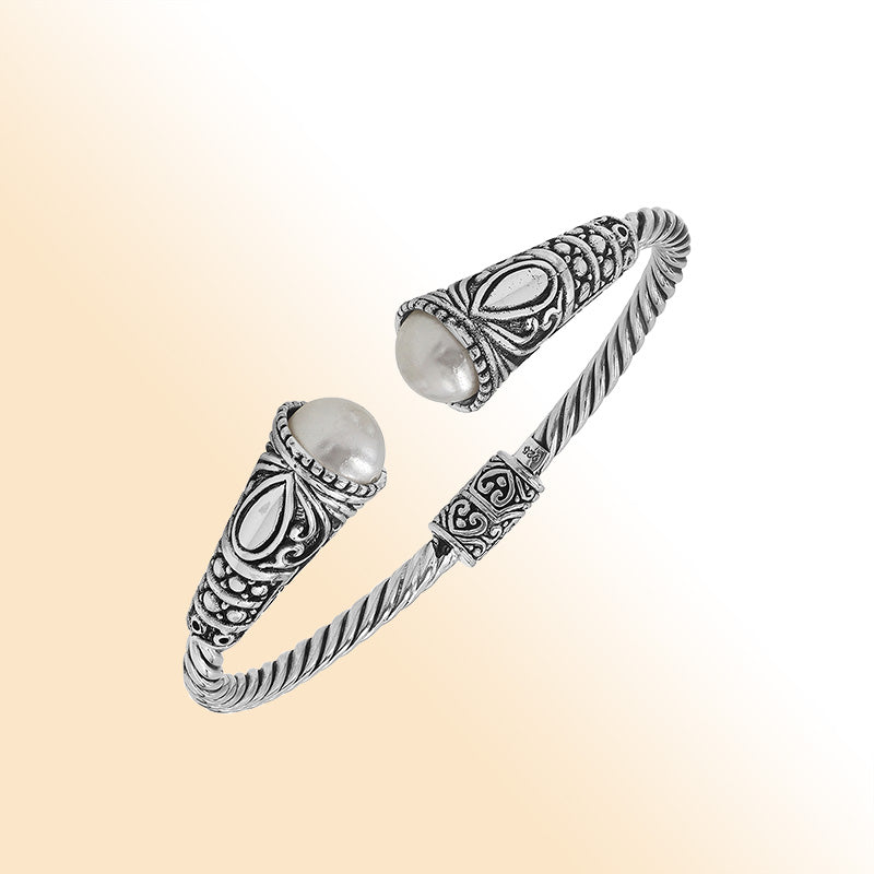 Elegant sterling silver open bangle with pearl accents and detailed Balinese pattern
