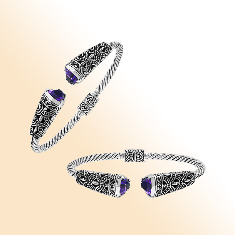 Elegant sterling silver open bangle with amethyst quartz accents and Balinese pattern