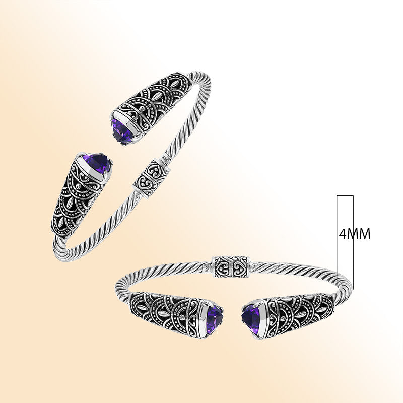 Elegant sterling silver open bangle with amethyst quartz accents and Balinese pattern