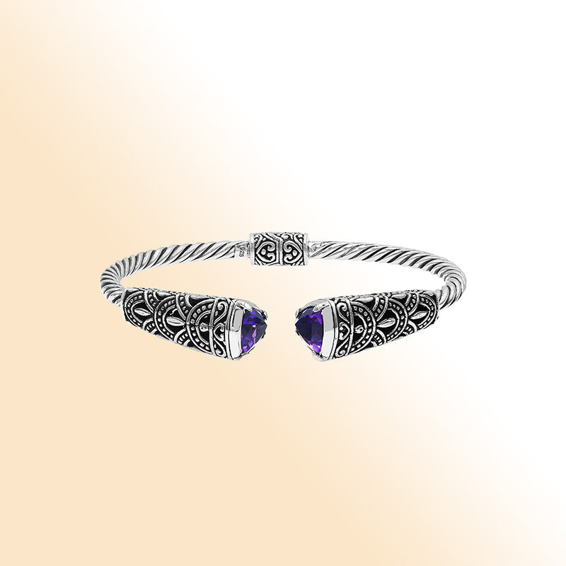 Elegant sterling silver open bangle with amethyst quartz accents and Balinese pattern