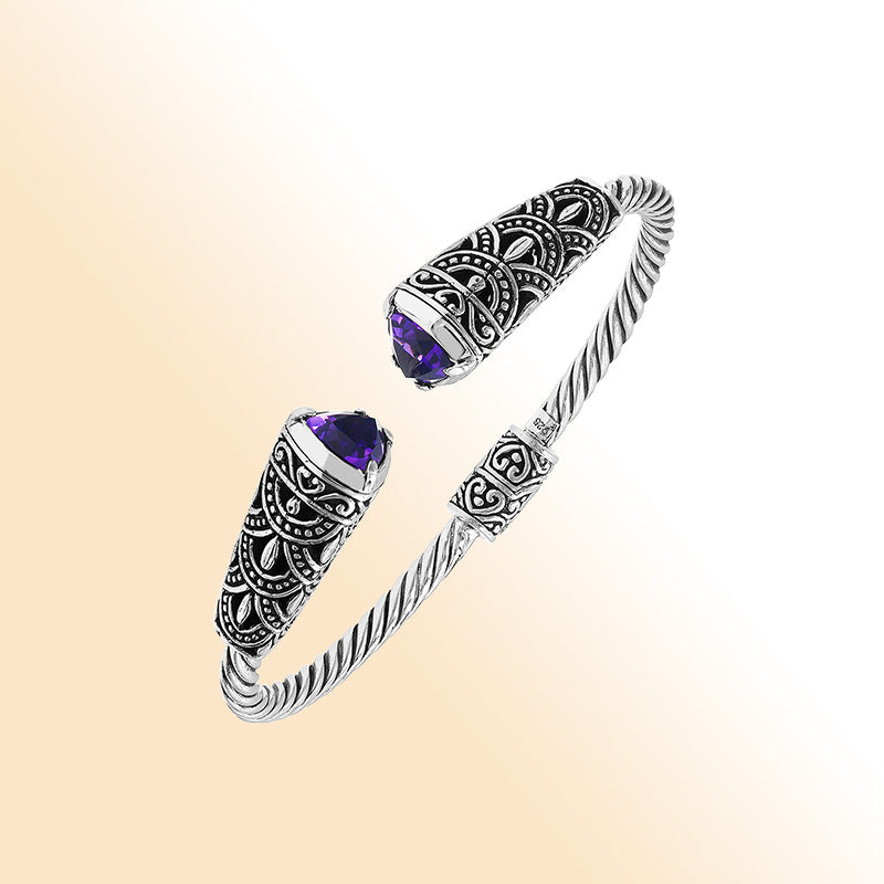 Elegant sterling silver open bangle with amethyst quartz accents and Balinese pattern
