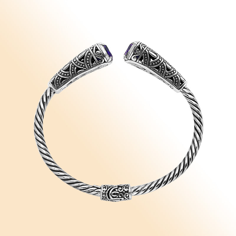 Elegant sterling silver open bangle with amethyst quartz accents and Balinese pattern