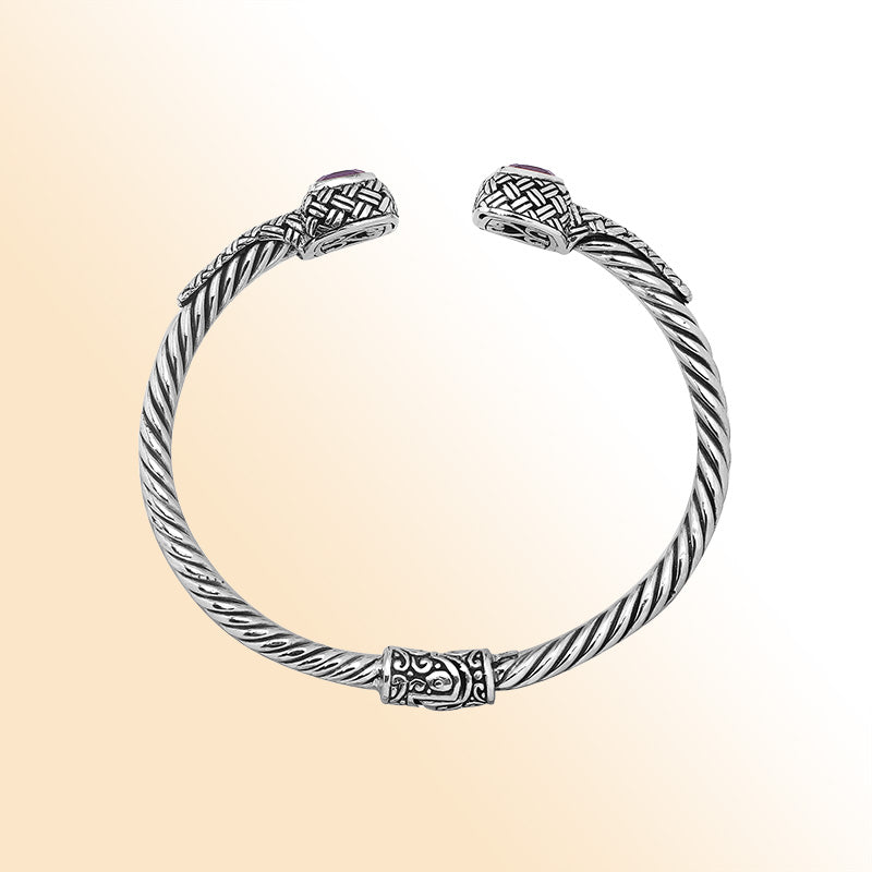 Elegant sterling silver braided bangle with amethyst quartz accents and Balinese detailing