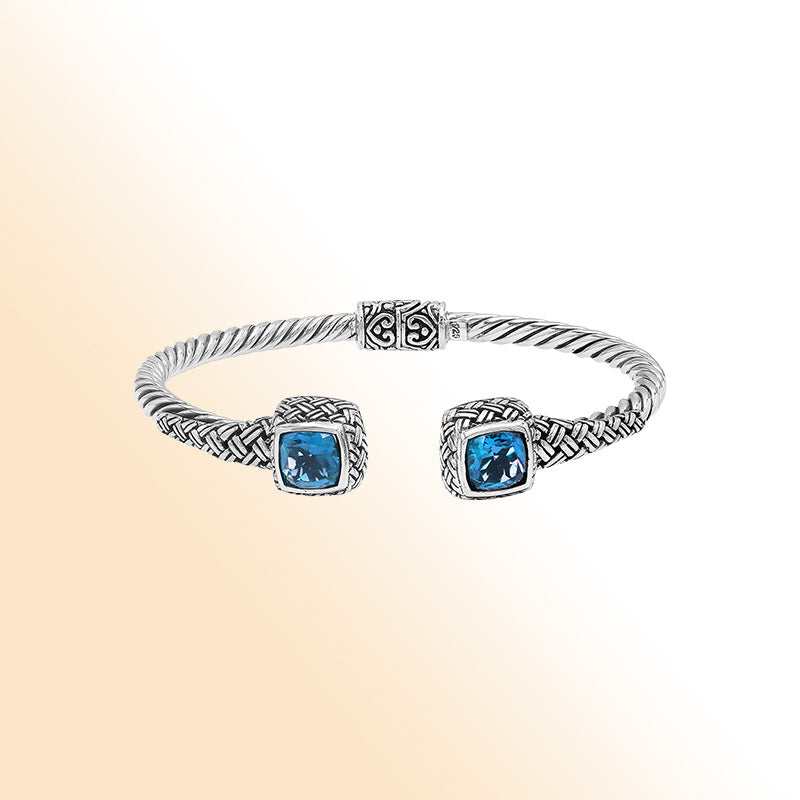 Elegant sterling silver braided bangle with blue topaz quartz accents and intricate Balinese pattern