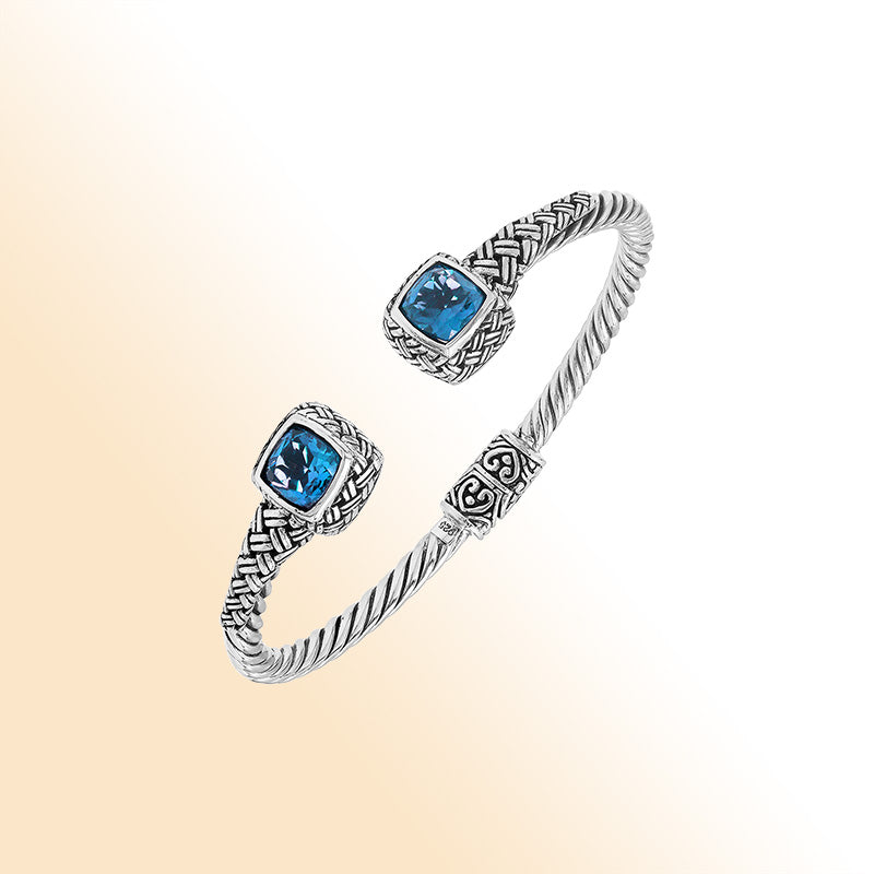 Elegant sterling silver braided bangle with blue topaz quartz accents and intricate Balinese pattern