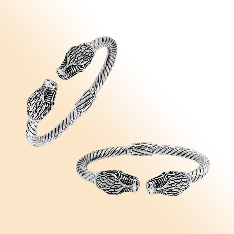 Sterling silver open bangle with dragon head motifs and twisted Balinese design