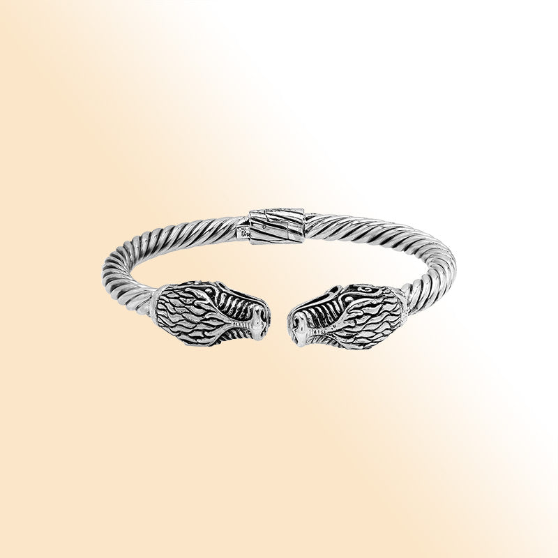 Sterling silver open bangle with dragon head motifs and twisted Balinese design