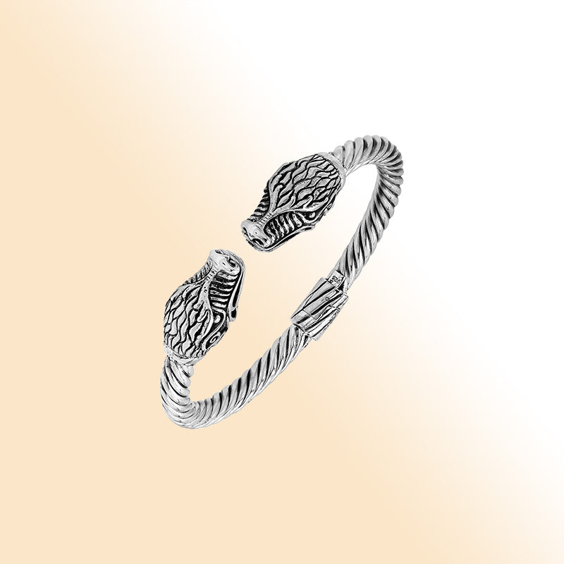 Sterling silver open bangle with dragon head motifs and twisted Balinese design