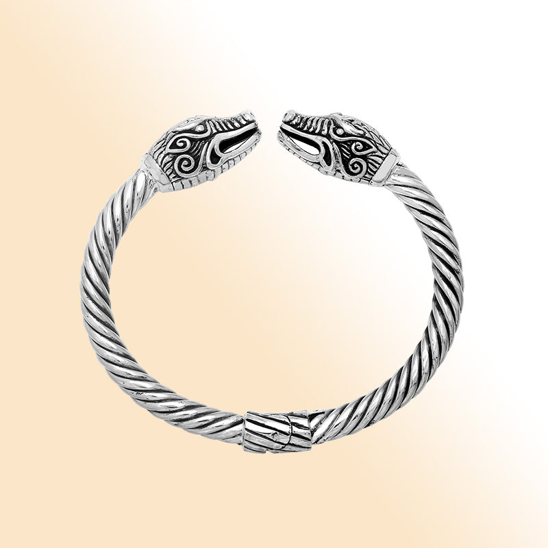 Sterling silver open bangle with dragon head motifs and twisted Balinese design