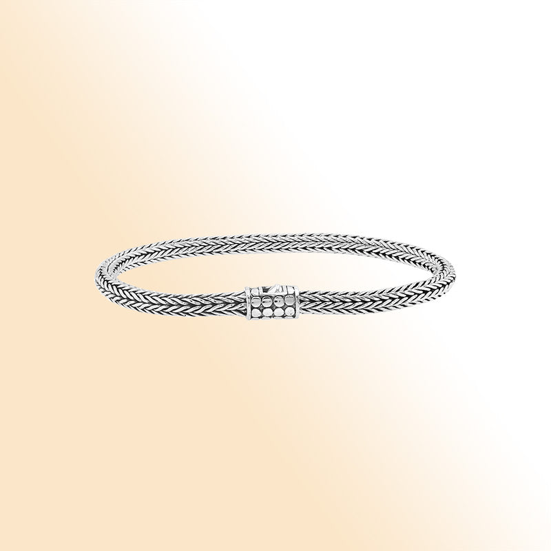 Elegant sterling silver wheat chain bracelet with dotted Balinese clasp and polished finish