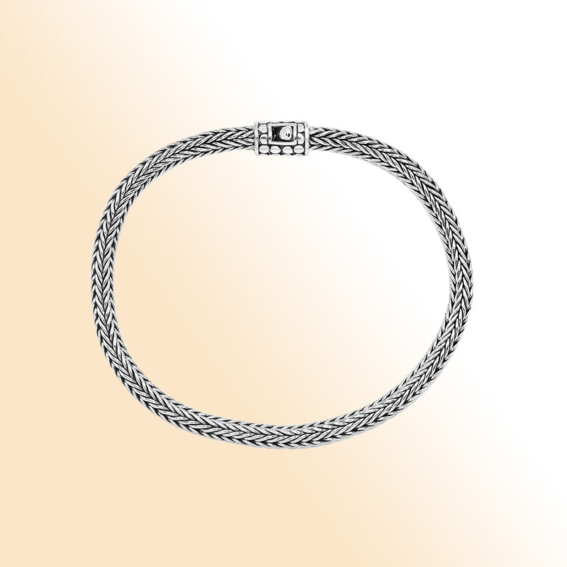 Elegant sterling silver wheat chain bracelet with dotted Balinese clasp and polished finish