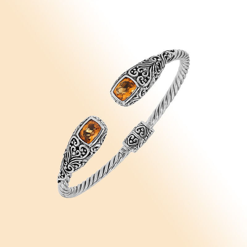 Sterling silver twisted bangle with citrine quartz ends and Balinese oxidized detailing