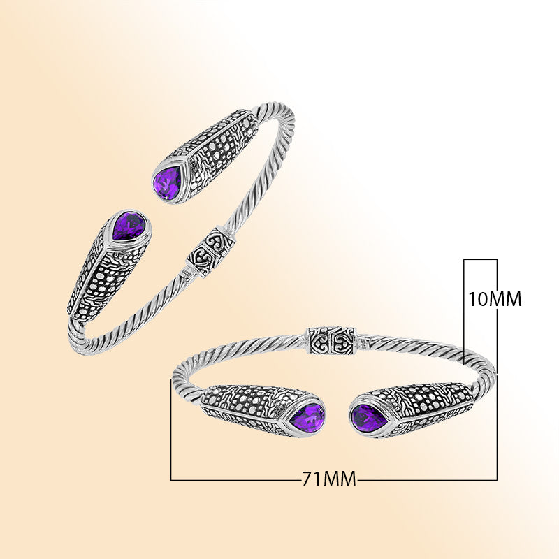 Elegant sterling silver open bangle with amethyst quartz accents and Balinese dot design