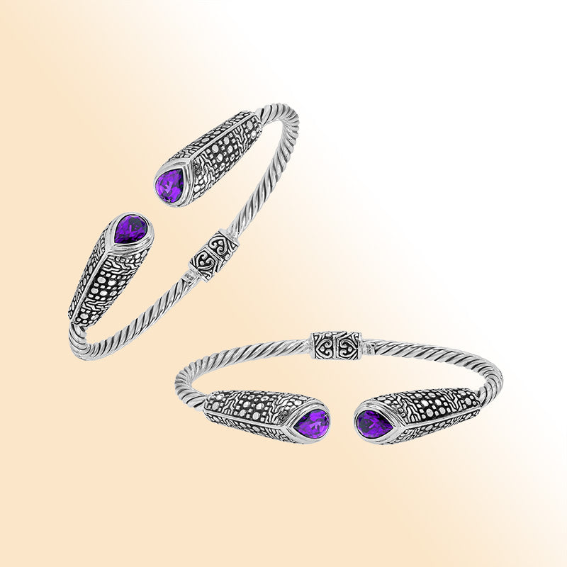 Elegant sterling silver open bangle with amethyst quartz accents and Balinese dot design