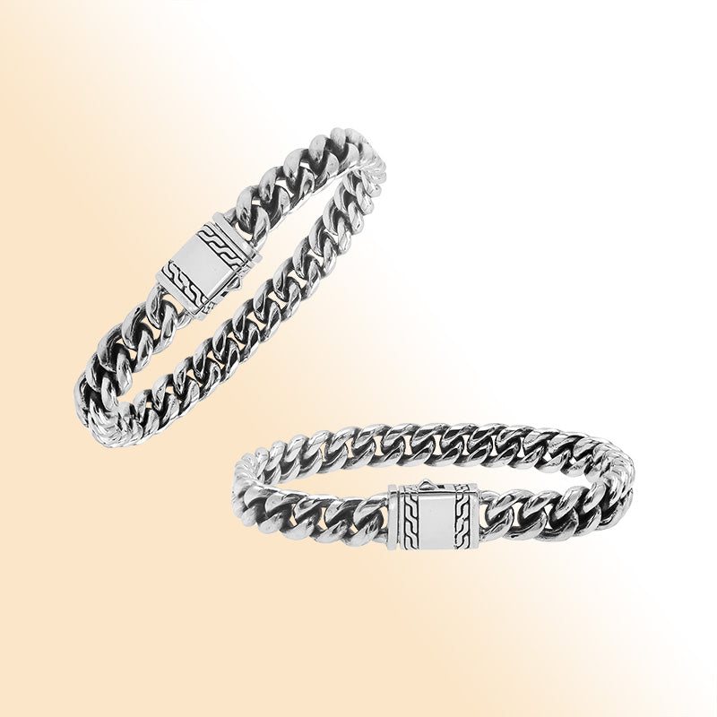 Elegant sterling silver Cuban chain bracelet with polished links and engraved clasp