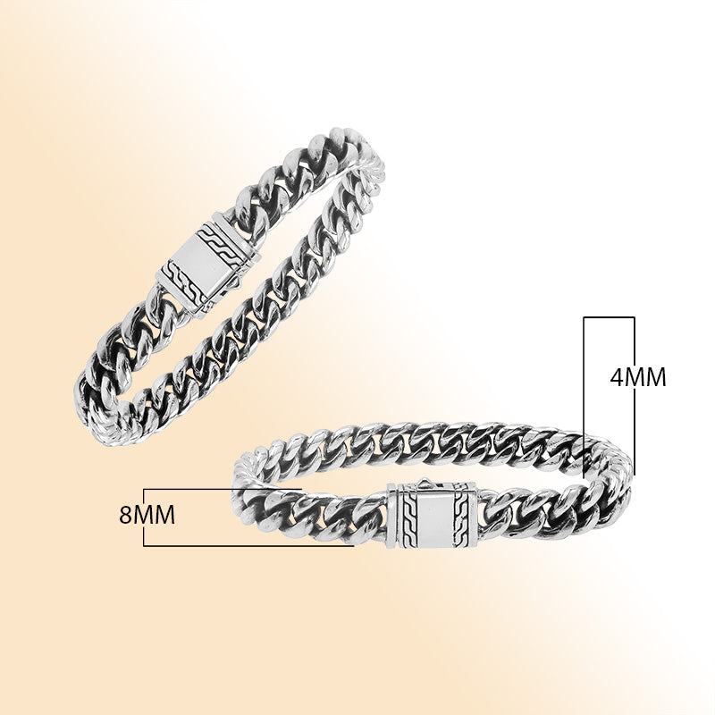 Elegant sterling silver Cuban chain bracelet with polished links and engraved clasp