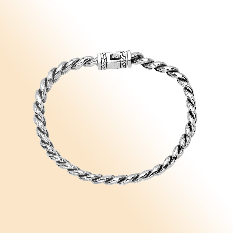 Elegant sterling silver Cuban chain bracelet with polished links and engraved clasp