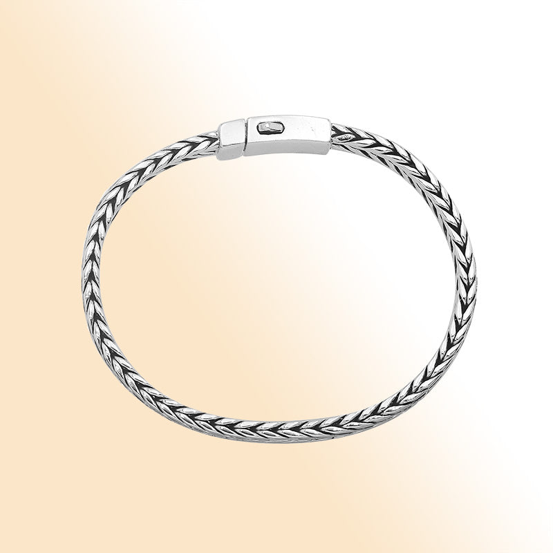 Elegant sterling silver wheat chain bracelet with cross clasp and polished Balinese design