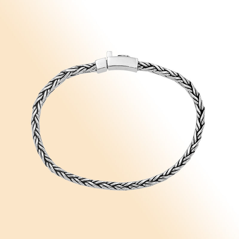 Elegant sterling silver wheat chain bracelet with cross push clasp and Balinese detailing