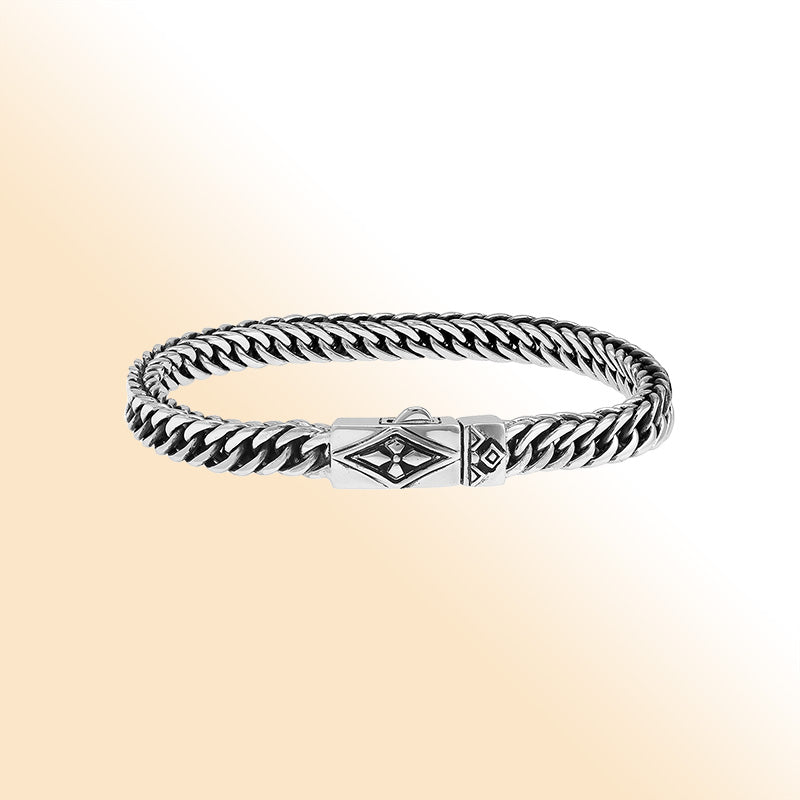 Sterling silver curb chain bracelet with geometric diamond clasp and oxidized finish