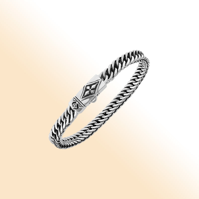 Sterling silver curb chain bracelet with geometric diamond clasp and oxidized finish