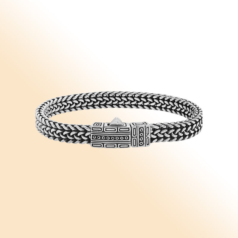 Sterling silver woven bracelet with geometric Balinese clasp and oxidized finish