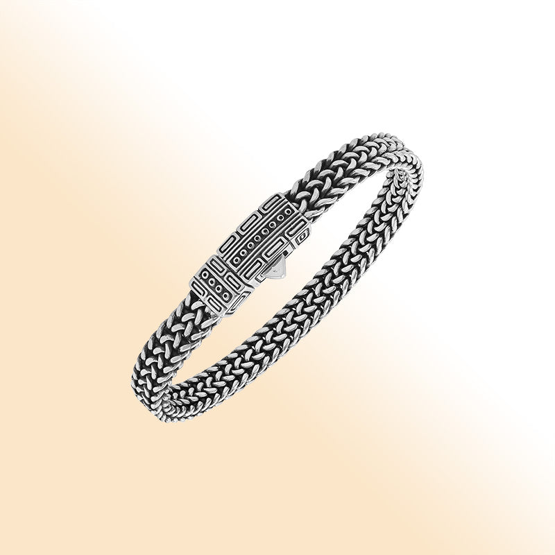 Sterling silver woven bracelet with geometric Balinese clasp and oxidized finish