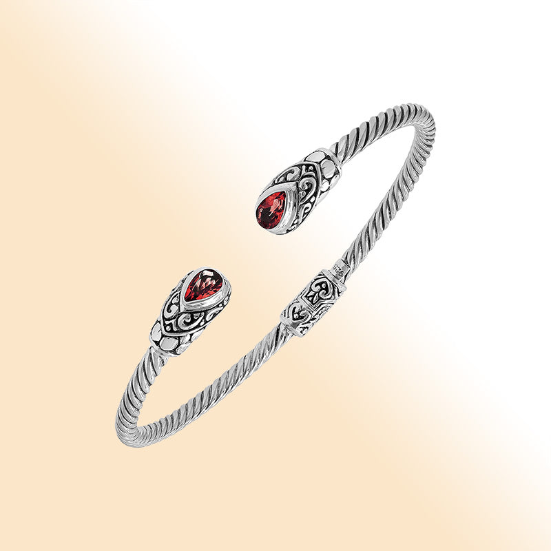 Sterling silver Balinese cuff bangle with Garnet Quartz charms and ornate scroll design.