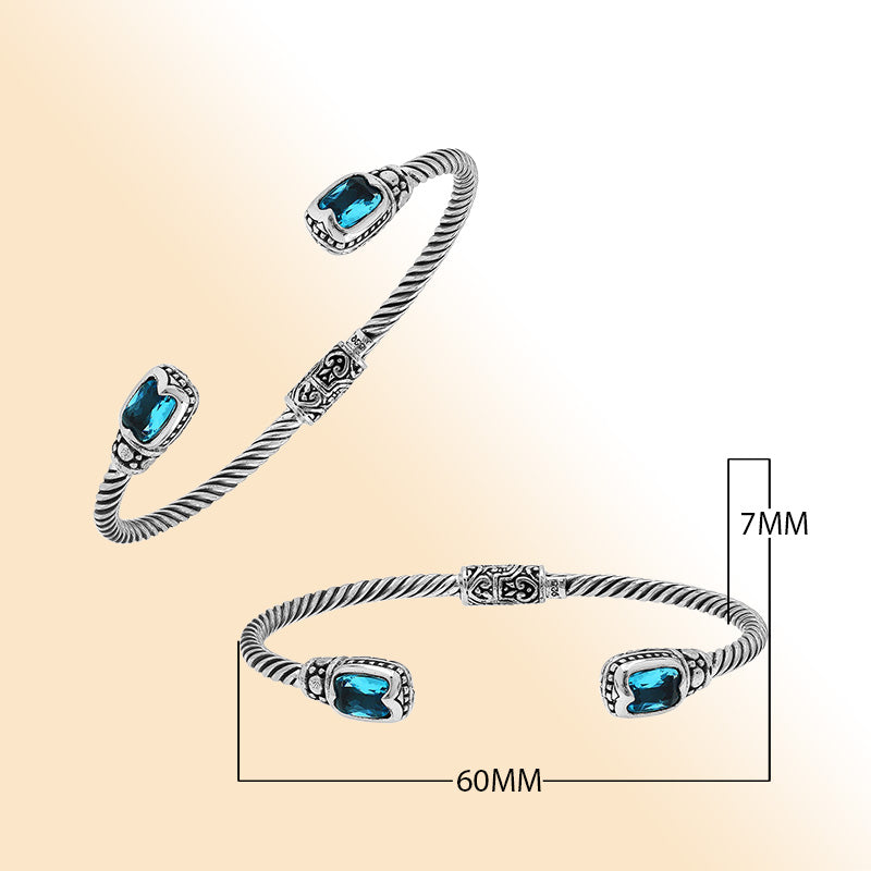 Sterling silver Balinese cuff bangle with Blue Topaz Quartz accents and intricate scroll design.