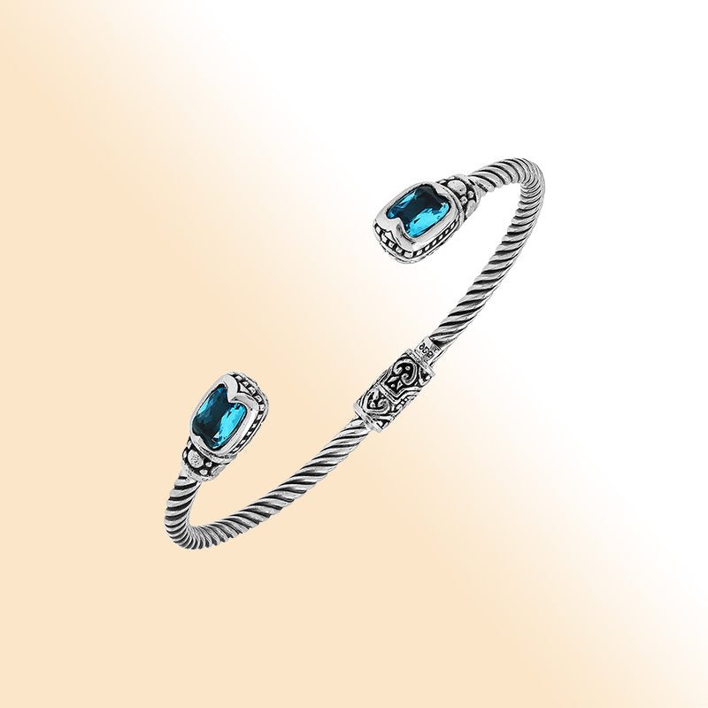Sterling silver Balinese cuff bangle with Blue Topaz Quartz accents and intricate scroll design.
