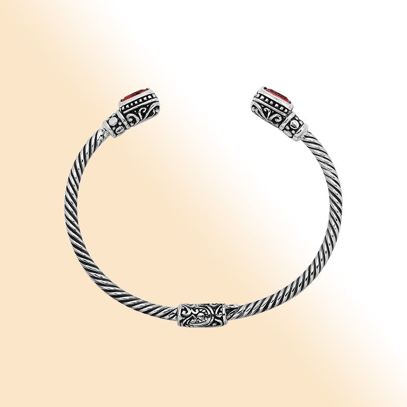 Sterling silver Balinese cuff bangle with Garnet Quartz accents and ornate scroll design.