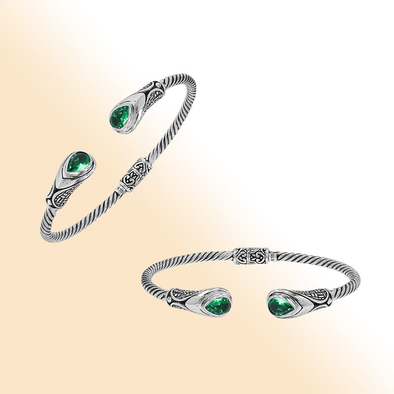 Sterling silver Balinese cuff bangle with Green Quartz accents and detailed scroll design.