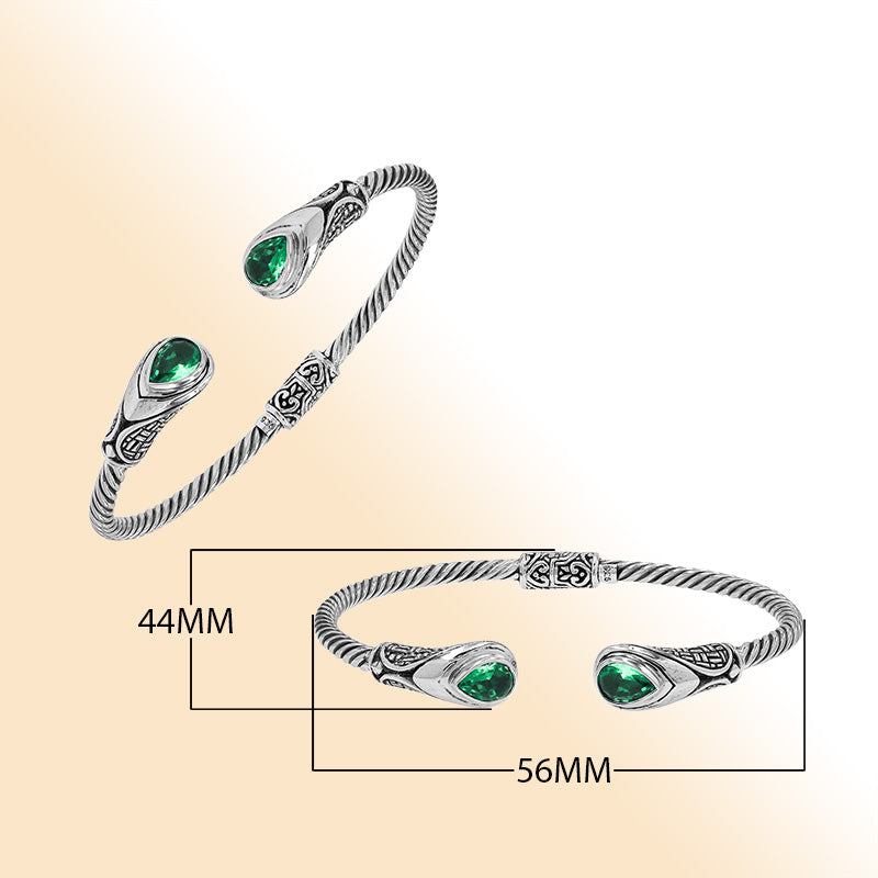 Sterling silver Balinese cuff bangle with Green Quartz accents and detailed scroll design.