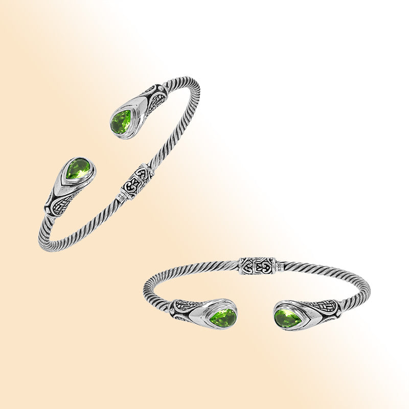 Sterling silver Balinese cuff bangle with Peridot Quartz accents and ornate scroll design.