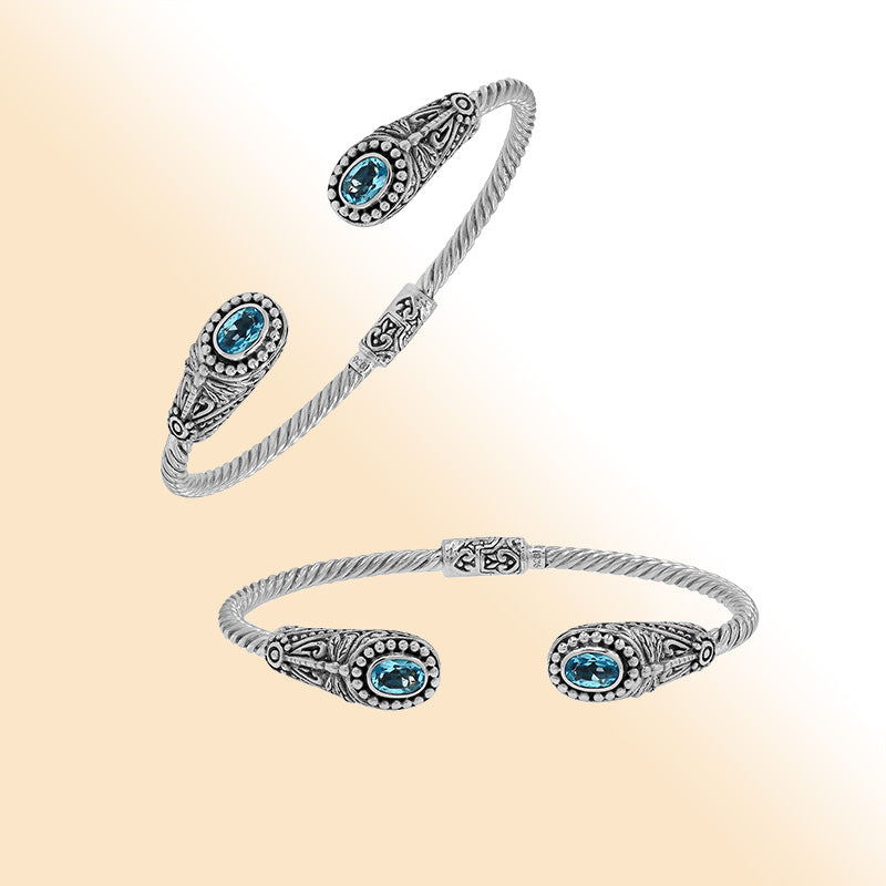 Sterling silver Balinese cuff bangle with Blue Topaz Quartz accents and ornate scroll design.