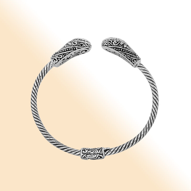 Sterling silver Balinese cuff bangle with Garnet Quartz accents and ornate scroll design.