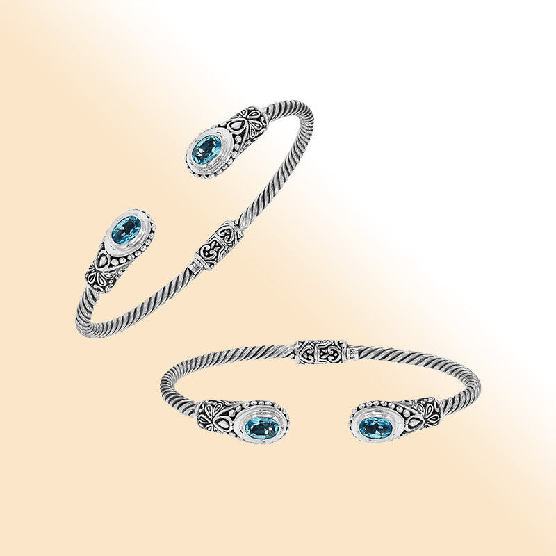 Sterling silver Balinese bangle with Blue Topaz Quartz stones and beaded scroll design.