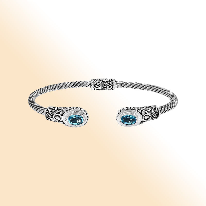 Sterling silver Balinese bangle with Blue Topaz Quartz stones and beaded scroll design.