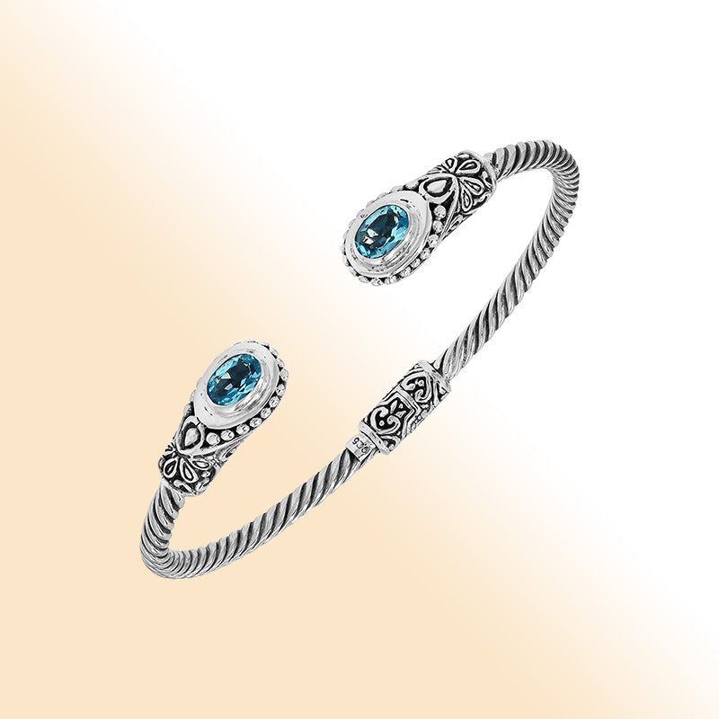 Sterling silver Balinese bangle with Blue Topaz Quartz stones and beaded scroll design.