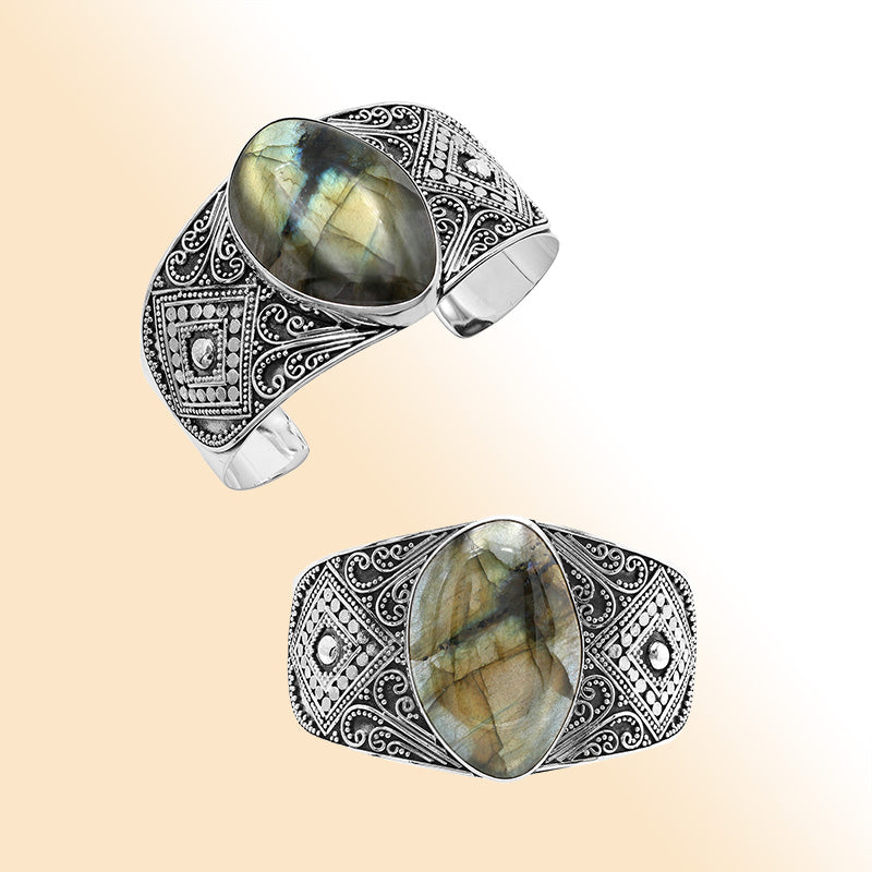 Sterling silver Balinese statement bangle with Labradorite centerpiece and intricate bead scrollwork.