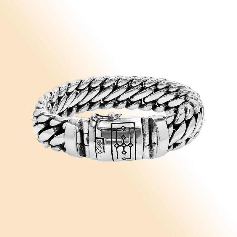 Sterling silver unisex curb chain bracelet with polished finish and engraved box clasp.