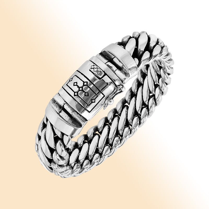Sterling silver unisex curb chain bracelet with polished finish and engraved box clasp.