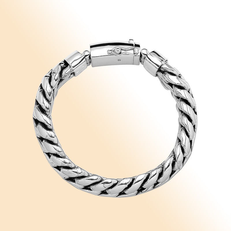 Sterling silver unisex curb chain bracelet with polished finish and engraved box clasp.