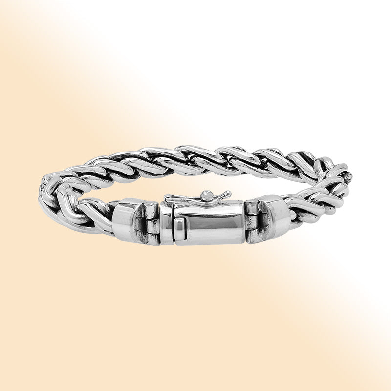 Sterling silver twisted chain bracelet with polished finish and secure box clasp.