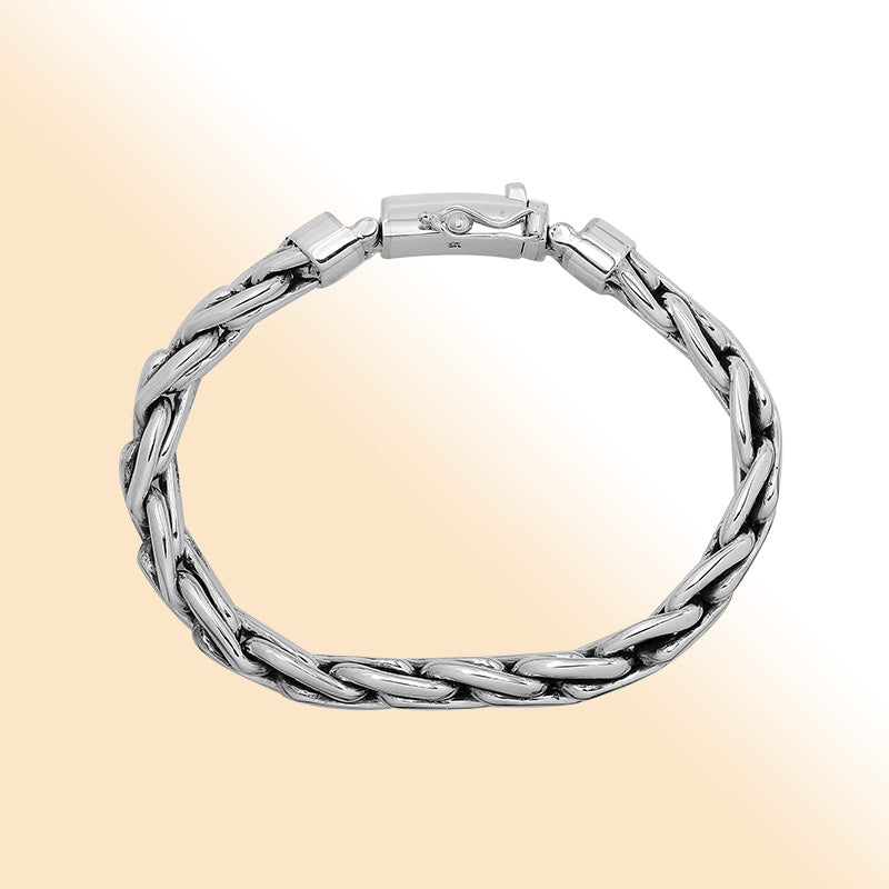 Sterling silver twisted chain bracelet with polished finish and secure box clasp.