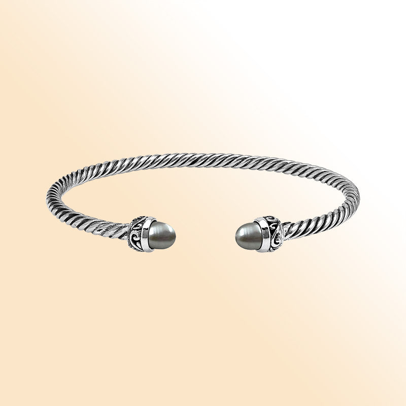 Handcrafted Sterling Silver Twisted Cable Bangle With Gray Mabe Pearls and Oxidized Tribal Detailing.